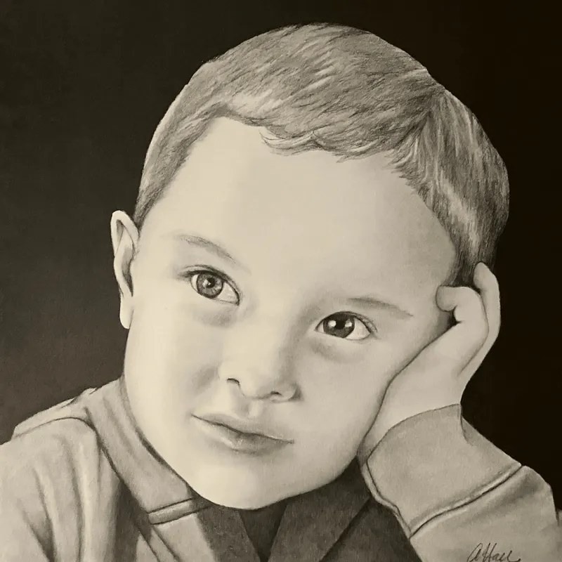 Boy resting his chin in his hand
