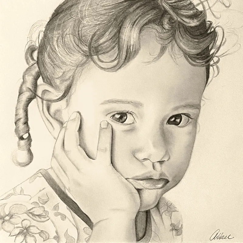 Girl with her hand on her cheek