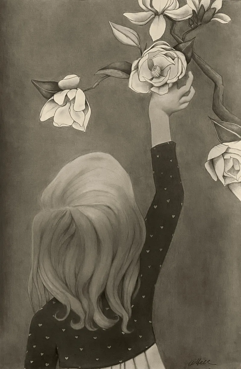 Girl reaching up to a magnolia branch
