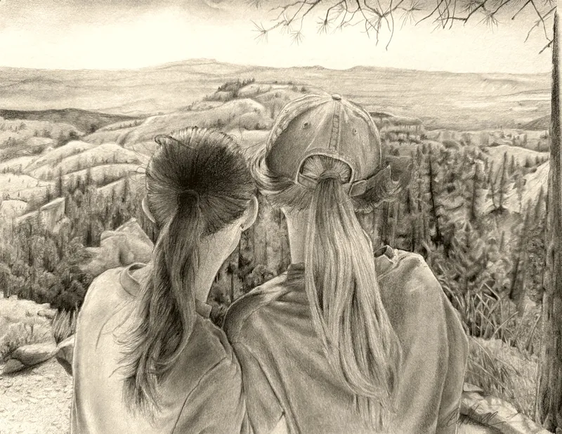Two girls overlooking a canyon vista