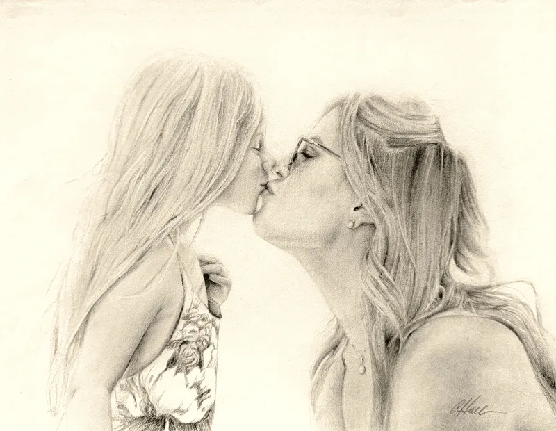 Mother and daughter sharing a kiss