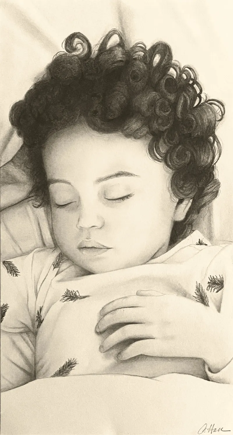 Sleeping baby with curly hair
