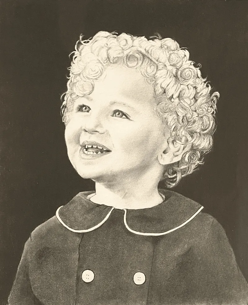 Smiling toddler with curly hair